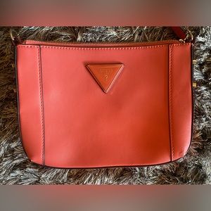 Guess Purse for sale!  It is a coral color, mid sized and in great shape.